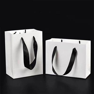Bolsos blancos con asa giratoria